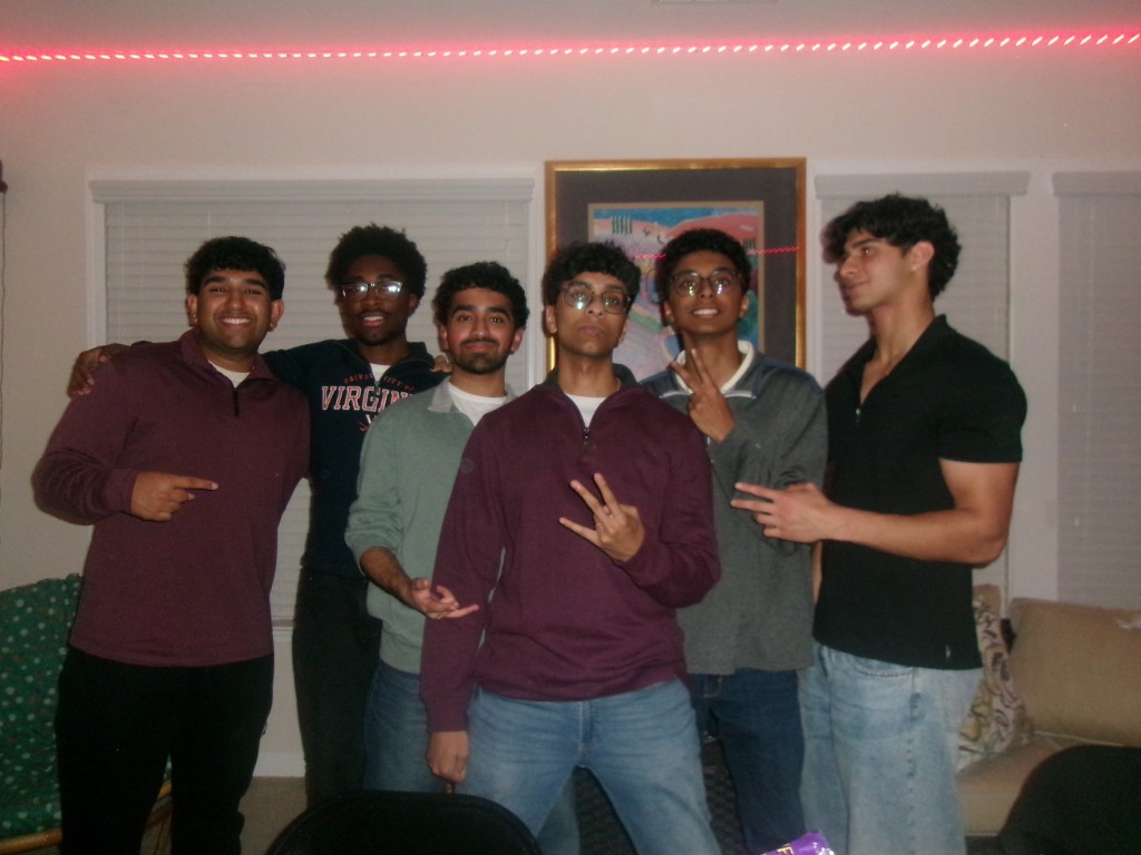 Six friends lined up in a living room